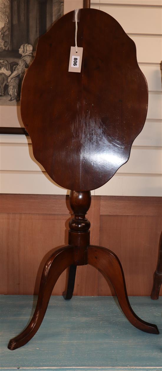 A Victorian mahogany shaped oval tilt top wine table W.51cm